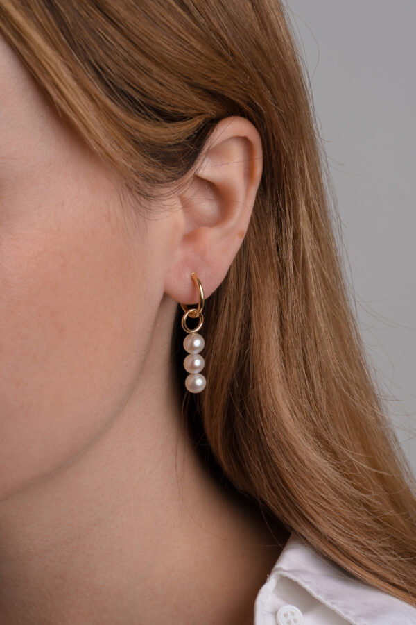 Charm tira perlas